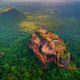 Aerial view of Sigiriya rock fortress in Sri Lanka surrounded by dense green jungle forest